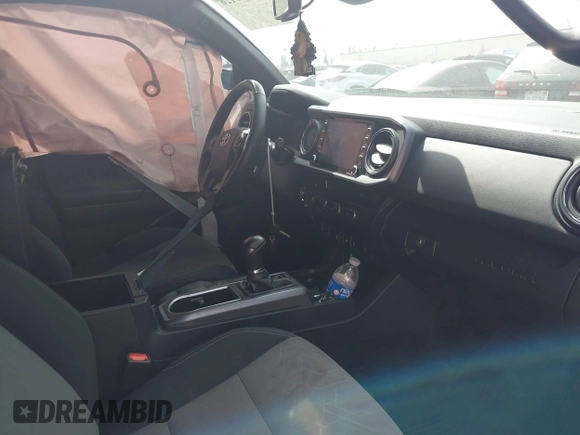 2023 Toyota Tacoma SR with VIN 3TMCZ5AN0PM635933, listed as a IAAI auction lot 42543126 with 32,960 mi miles and . Bid and sale history available at DreamBid. Image 5.