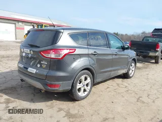2015 Ford Escape SE with VIN 1FMCU0GXXFUB99852, listed as a IAAI auction lot 41704198 with 84,735 mi miles. Bid and sale history available at carsss.com. Image 4.