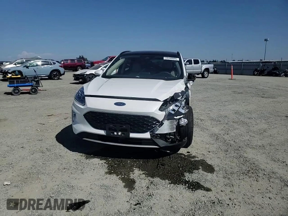 2020 Ford Escape Titanium Hybrid z VIN 1FMCU9DZ6LUC47658, wystawiony jako Copart lot #59599995 z przebiegiem 63 004 mil mil oraz Szkoda całkowita • Salvage title. Historia ofert i sprzedaży dostępna na DreamBid. Obrazek 13.