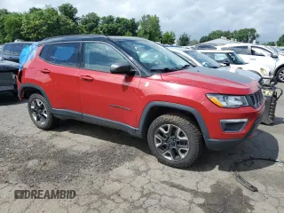 2017 Jeep Compass Trailhawk with VIN 3C4NJDDB7HT657463, listed as a Copart auction lot 60650765 with 100,979 mi miles and Salvage title. Bid and sale history available at DreamBid. Image 4.