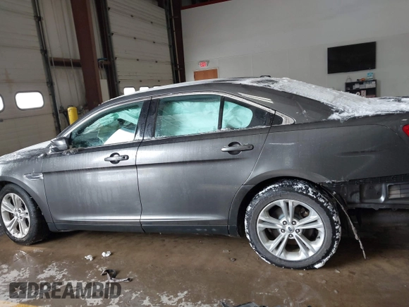 2015 Ford Taurus SEL with VIN 1FAHP2E89FG202589, listed as a IAAI auction lot 41592298 with 105,410 mi miles and . Bid and sale history available at carsss.com. Image 14.