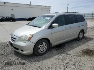 2005 Honda Odyssey EX-L with VIN 5FNRL38745B116330, listed as a Copart auction lot 57990585 with 254,168 mi miles and Salvage title. Bid and sale history available at DreamBid. Image 1.