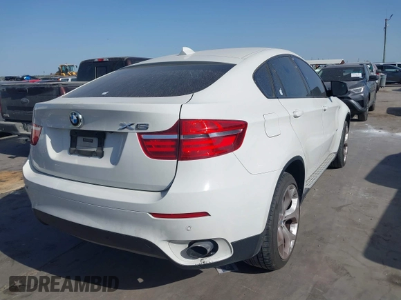 2014 BMW X6 xDrive35i z VIN 5UXFG2C5XE0C44062, wystawiony jako IAAI lot #41848304 z przebiegiem 154 683 mil mil oraz . Historia ofert i sprzedaży dostępna na DreamBid. Obrazek 4.