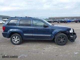 2010 Jeep Grand Cherokee Laredo with VIN 1J4PR4GK5AC138498, listed as a IAAI auction lot 41870740 with 130,551 mi miles. Bid and sale history available at carsss.com. Image 13.