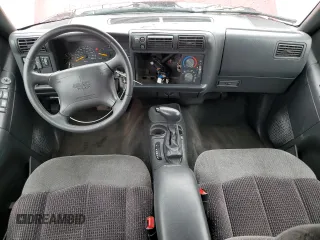1997 GMC Jimmy SLS with VIN 1GKDT13W8V2515536, listed as a Copart auction lot 66701094 with 123,051 mi miles and Salvage Title. Bid and sale history available at carsss.com. Image 8.