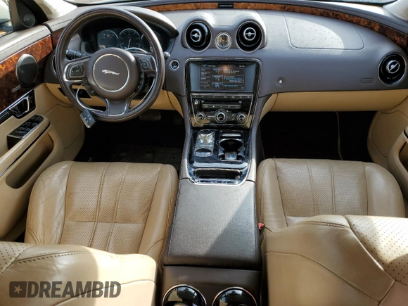 2014 Jaguar XJ with VIN SAJWA1CZ5E8V71971, listed as a Copart auction lot 82116114 with 127,164 mi miles and Salvage Title. Bid and sale history available at DreamBid. Image 8.