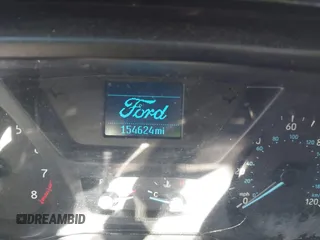 2019 Ford Transit Cargo with VIN 1FTBW3XM2KKB40981, listed as a IAAI auction lot 41558356 with 154,624 mi miles and . Bid and sale history available at DreamBid. Image 14.
