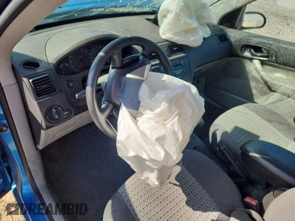 2007 Ford Focus S z VIN 1FAFP34N87W107744, wystawiony jako Copart lot #61934615 z przebiegiem Nie podano mil oraz Szkoda całkowita • Salvage title. Historia ofert i sprzedaży dostępna na DreamBid. Obrazek 8.