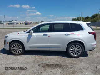 2020 Cadillac XT6 FWD Premium Luxury z VIN 1GYKPCRS1LZ228982, wystawiony jako IAAI lot #41975364 z przebiegiem 84 803 mil mil oraz . Historia ofert i sprzedaży dostępna na DreamBid. Obrazek 13.