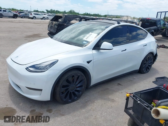 2021 Tesla Model Y Performance with VIN 5YJYGDEF9MF081798, listed as a IAAI auction lot 42033358 with 64,679 mi miles and . Bid and sale history available at DreamBid. Image 18.