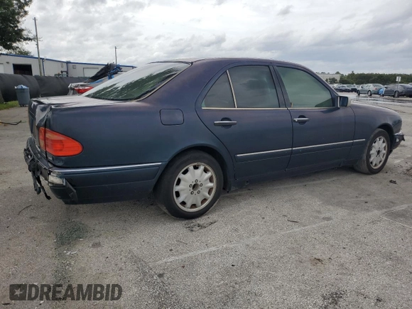 1997 Mercedes-Benz E-Class with VIN WDBJF55F4VJ025769, listed as a Copart auction lot 73460164 with 0 mi miles and Salvage Title. Bid and sale history available at carsss.com. Image 3.