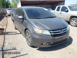 2015 Honda Odyssey Touring Elite z VIN 5FNRL5H98FB034700, wystawiony jako IAAI lot #42019265 z przebiegiem 226 829 mil mil oraz . Historia ofert i sprzedaży dostępna na DreamBid. Obrazek 1.