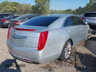 2013 Cadillac XTS Premium z VIN 2G61S5S30D9184910, wystawiony jako IAAI lot #40220419 z przebiegiem 111 330 mil mil oraz . Historia ofert i sprzedaży dostępna na DreamBid. Obrazek 4.