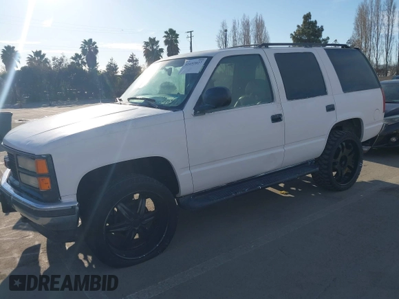 1997 GMC Yukon with VIN 1GKEK13R9VJ741768, listed as a IAAI auction lot 41692027 with 200,681 mi miles. Bid and sale history available at carsss.com. Image 2.