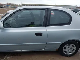 2003 Hyundai Accent GL with VIN KMHCG35C23U264360, listed as a IAAI auction lot 42033316 with 100,991 mi miles. Bid and sale history available at carsss.com. Image 14.