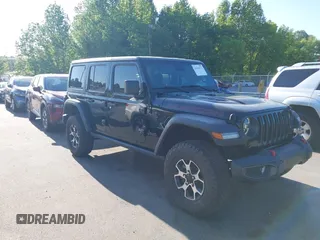 2022 Jeep Wrangler Unlimited Rubicon z VIN 1C4HJXFNXNW149063, wystawiony jako IAAI lot #42130171 z przebiegiem 33 961 mil mil oraz . Historia ofert i sprzedaży dostępna na DreamBid. Obrazek 1.