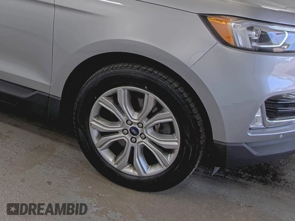 2020 Ford Edge Titanium z VIN 2FMPK4K91LBA91290, wystawiony jako IAAI lot #42494043 z przebiegiem 71 254 mil mil oraz . Historia ofert i sprzedaży dostępna na DreamBid. Obrazek 10.