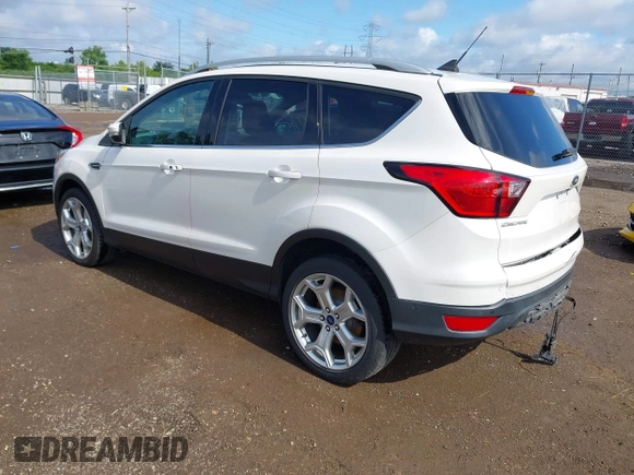 2019 Ford Escape Titanium with VIN 1FMCU9J98KUA95238, listed as a IAAI auction lot 42525324 with 59,222 mi miles and . Bid and sale history available at DreamBid. Image 3.