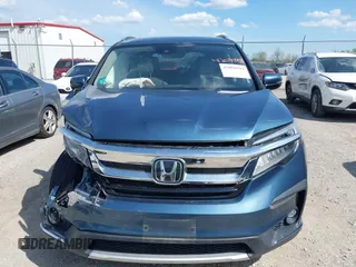 2020 Honda Pilot Touring 8-Passenger with VIN 5FNYF6H93LB034009, listed as a IAAI auction lot 42090993 with 73,325 mi miles and . Bid and sale history available at carsss.com. Image 12.