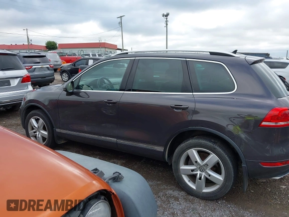 2012 Volkswagen Touareg Sport with VIN WVGFK9BP0CD002939, listed as a IAAI auction lot 42531654 with 222,435 mi miles and . Bid and sale history available at DreamBid. Image 14.