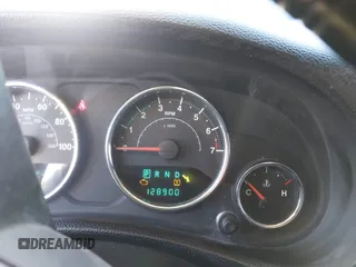 2014 Jeep Wrangler Unlimited Sahara with VIN 1C4BJWEG0EL273475, listed as a IAAI auction lot 41515425 with 128,900 mi miles. Bid and sale history available at carsss.com. Image 15.