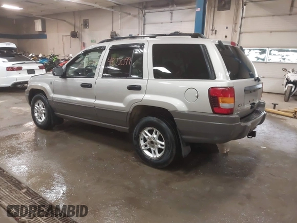 2004 Jeep Grand Cherokee Laredo with VIN 1J4GW48S44C321869, listed as a IAAI auction lot 41822099 with 181,663 mi miles. Bid and sale history available at carsss.com. Image 3.