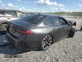 2024 BMW i5 eDrive40 with VIN WBY33FK04RCR49355, listed as a Copart auction lot 55828475 with Not Provided miles and Salvage Title. Bid and sale history available at DreamBid. Image 3.