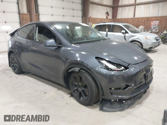 2023 Tesla Model Y Long Range with VIN 7SAYGAEE2PF755674, listed as a IAAI auction lot 41890025 with 24,783 mi miles and . Bid and sale history available at DreamBid. Image 1.