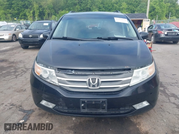 2011 Honda Odyssey Touring with VIN 5FNRL5H93BB104906, listed as a IAAI auction lot 42371279 with 183,856 mi miles and . Bid and sale history available at DreamBid. Image 12.