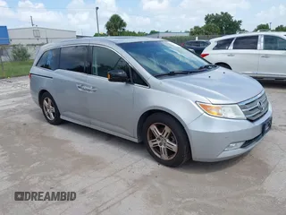 2012 Honda Odyssey Touring с VIN 5FNRL5H92CB008363, выставлен на аукционе IAAI как лот 42503141 с пробегом 169 260 миль миль и . История ставок и продаж доступна на DreamBid. Изображение 1.