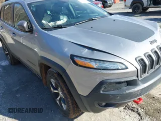 2016 Jeep Cherokee Trailhawk z VIN 1C4PJMBB6GW335837, wystawiony jako IAAI lot #41547478 z przebiegiem 236 483 mil mil oraz . Historia ofert i sprzedaży dostępna na DreamBid. Obrazek 17.