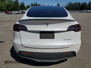 2020 Tesla Model Y Long Range with VIN 5YJYGDEF9LF023060, listed as a Copart auction lot 55462395 with 58,211 mi miles and Salvage Title. Bid and sale history available at DreamBid. Image 6.