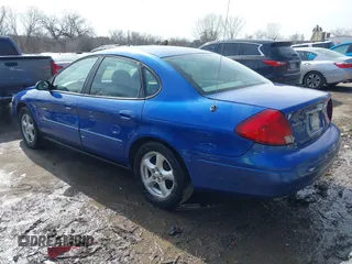 2003 Ford Taurus SE Standard with VIN 1FAFP53233G208763, listed as a IAAI auction lot 41661923 with 127,830 mi miles. Bid and sale history available at carsss.com. Image 3.