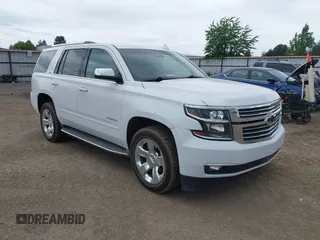 2016 Chevrolet Tahoe LTZ with VIN 1GNSKCKCXGR140257, listed as a IAAI auction lot 42572646 with 157,402 mi miles and . Bid and sale history available at DreamBid. Image 1.