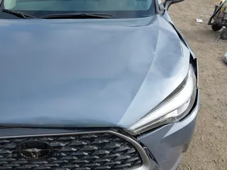 2022 Toyota Corolla Cross XLE with VIN 7MUDAABG6NV007009, listed as a IAAI auction lot 42409061 with 37,178 mi miles and . Bid and sale history available at DreamBid. Image 12.