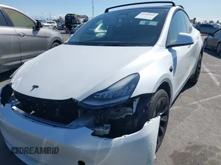 2023 Tesla Model Y Long Range with VIN 7SAYGDEEXPA152986, listed as a IAAI auction lot 41946665 with 13,574 mi miles and . Bid and sale history available at carsss.com. Image 12.