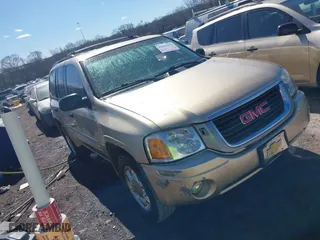 2004 GMC Envoy SLE with VIN 1GKDS13S442179334, listed as a IAAI auction lot 41693042 with 224,868 mi miles. Bid and sale history available at carsss.com. Image 1.