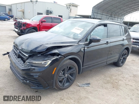 2023 Volkswagen Tiguan SE R-Line Black with VIN 3VVCB7AX0PM122636, listed as a IAAI auction lot 42040494 with 8,589 mi miles and . Bid and sale history available at DreamBid. Image 2.
