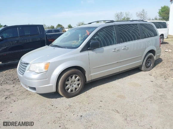 2010 Chrysler Town & Country LX with VIN 2A4RR4DE2AR113041, listed as a IAAI auction lot 41912924 with 200,143 mi miles. Bid and sale history available at carsss.com. Image 2.