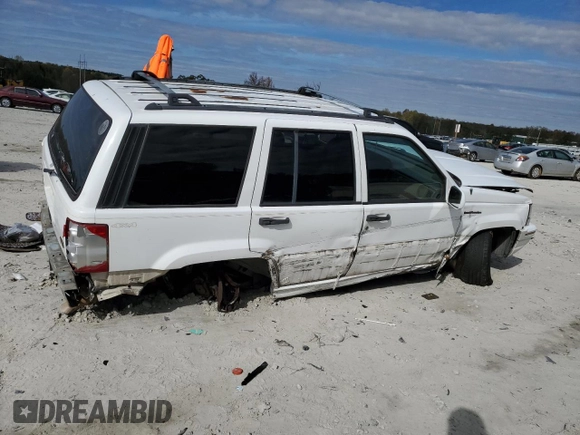 1995 Jeep Grand Cherokee Limited with VIN 1J4GZ78Y2SC788413, listed as a Copart auction lot 80297444 with 309,566 mi miles and Salvage Title. Bid and sale history available at carsss.com. Image 3.