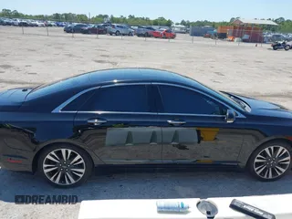 2018 Lincoln MKZ Reserve z VIN 3LN6L5E91JR602506, wystawiony jako IAAI lot #41976529 z przebiegiem 93 394 mil mil oraz . Historia ofert i sprzedaży dostępna na DreamBid. Obrazek 13.