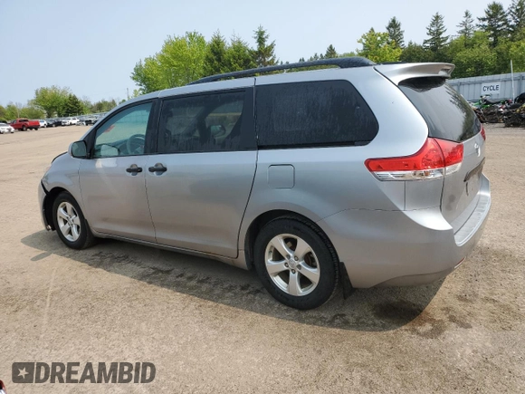 2014 Toyota Sienna L with VIN 5TDZK3DC8ES442973, listed as a Copart auction lot 59660055 with 310,496 mi miles and Salvage title. Bid and sale history available at DreamBid. Image 2.