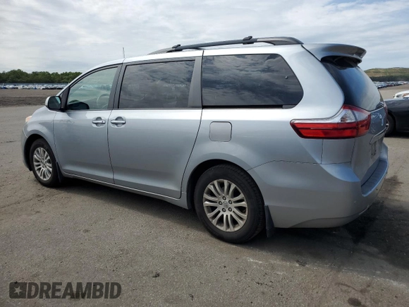 2015 Toyota Sienna XLE with VIN 5TDYK3DC2FS529006, listed as a Copart auction lot 62750995 with 142,990 mi miles and Salvage title. Bid and sale history available at DreamBid. Image 2.