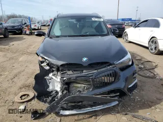 2018 BMW X1 xDrive28i with VIN WBXHT3C31J5K25021, listed as a Copart auction lot 48779555 with 71,741 mi miles and Salvage Title. Bid and sale history available at carsss.com. Image 5.