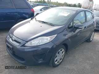 2013 Ford Fiesta SE with VIN 3FADP4EJ6DM205708, listed as a IAAI auction lot 42051721 with 139,143 mi miles. Bid and sale history available at carsss.com. Image 2.