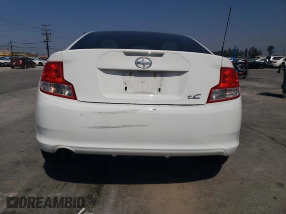2013 Scion tC z VIN JTKJF5C77D3063067, wystawiony jako Copart lot #54264625 z przebiegiem 74 351 mil mil oraz Szkoda całkowita • Salvage title. Historia ofert i sprzedaży dostępna na DreamBid. Obrazek 6.