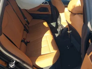 2024 BMW i4 eDrive40 z VIN WBY73AW02RFT29049, wystawiony jako IAAI lot #41636126 z przebiegiem 6670 mil mil oraz . Historia ofert i sprzedaży dostępna na DreamBid. Obrazek 8.