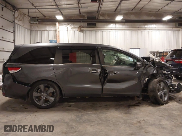 2021 Honda Odyssey Touring with VIN 5FNRL6H82MB025923, listed as a IAAI auction lot 42104290 with 61,178 mi miles and . Bid and sale history available at DreamBid. Image 14.