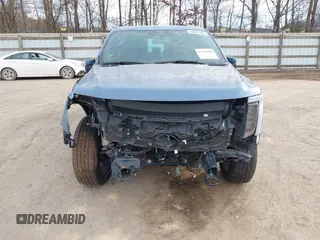 2023 Ford F-150 Lightning Pro with VIN 1FT6W1EVXPWG34958, listed as a IAAI auction lot 41732898 with 10,573 mi miles and . Bid and sale history available at DreamBid. Image 12.