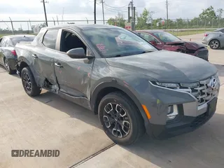 2022 Hyundai Santa Cruz SEL z VIN 5NTJBDAE4NH022823, wystawiony jako IAAI lot #42051616 z przebiegiem 23 158 mil mil oraz . Historia ofert i sprzedaży dostępna na DreamBid. Obrazek 1.